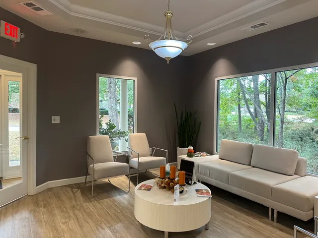 Modern, comfortable reception area with elegant seating and natural lighting